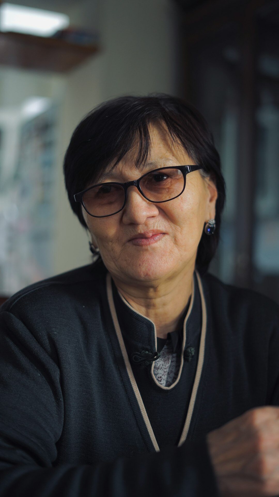 Portrait of a senior woman editor with glasses