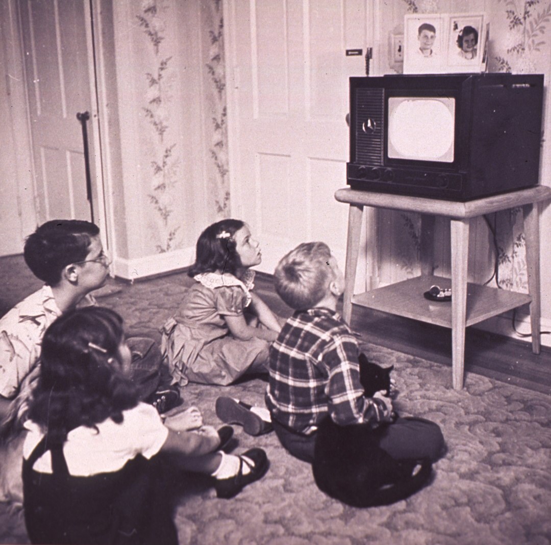 family watching old tv
