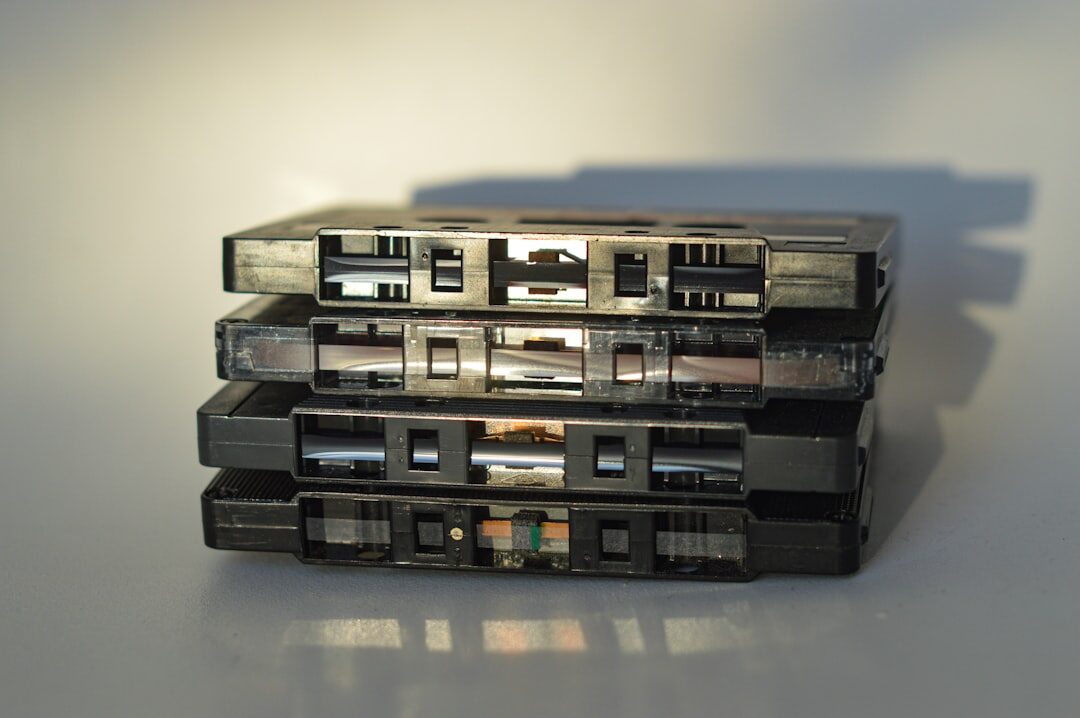 Stack of vintage film reels and video cassettes